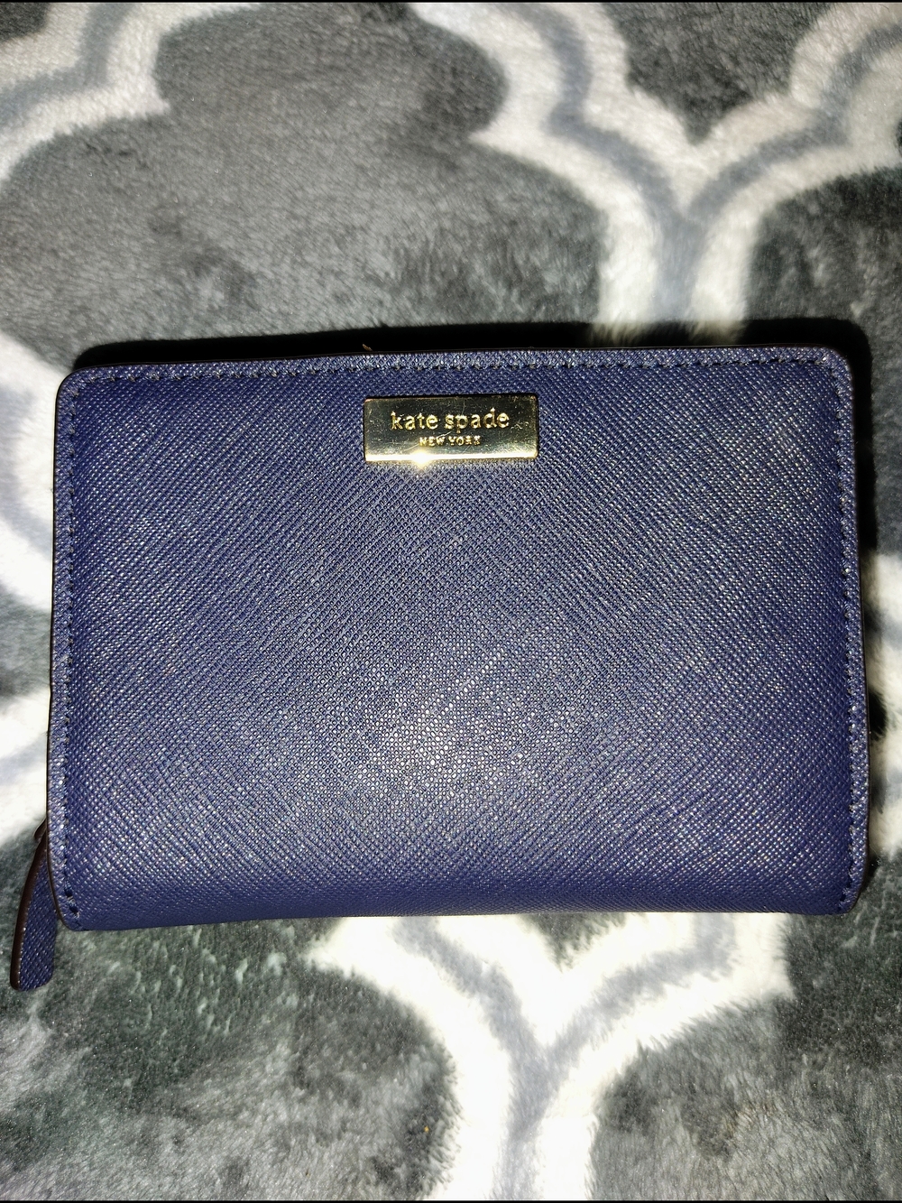 kate spade navy blue Saffiano leather bifold wallet with gold logo